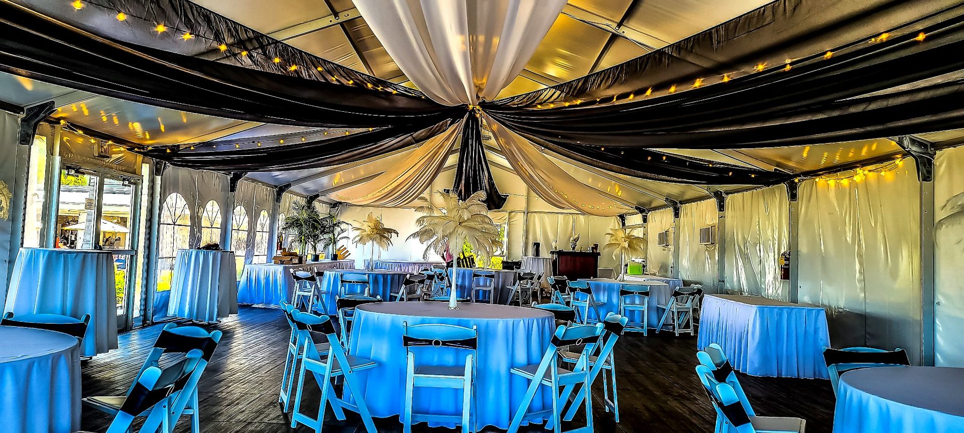 Ceiling drapery — black-and-white ceiling swags sweeping across a tent reception, by Altitude Event Design and Decor, Tampa Bay