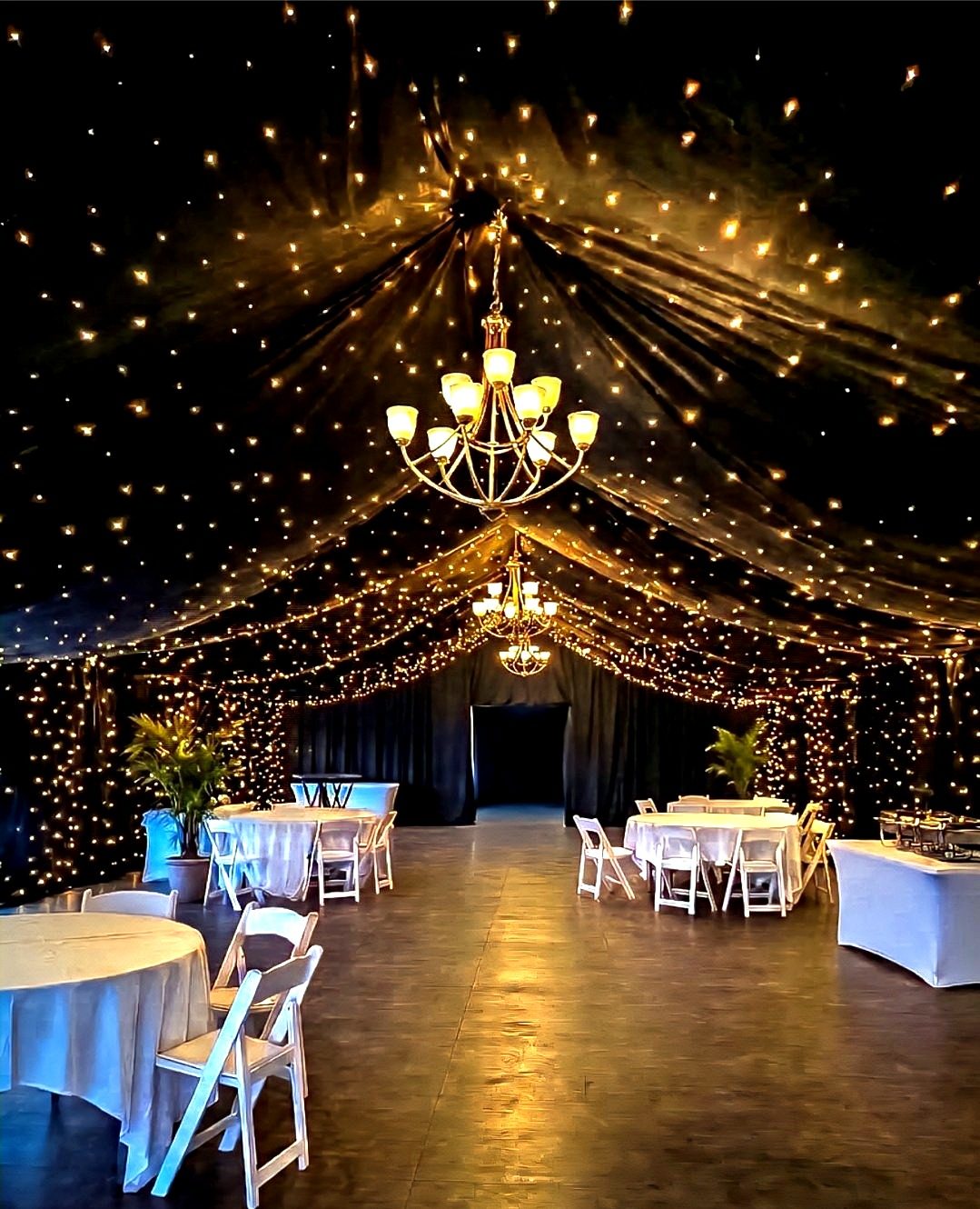 Starry Night ceiling — starlit drape radiating from a centre chandelier inside a tent, by Altitude Event Design and Decor, Tampa Bay