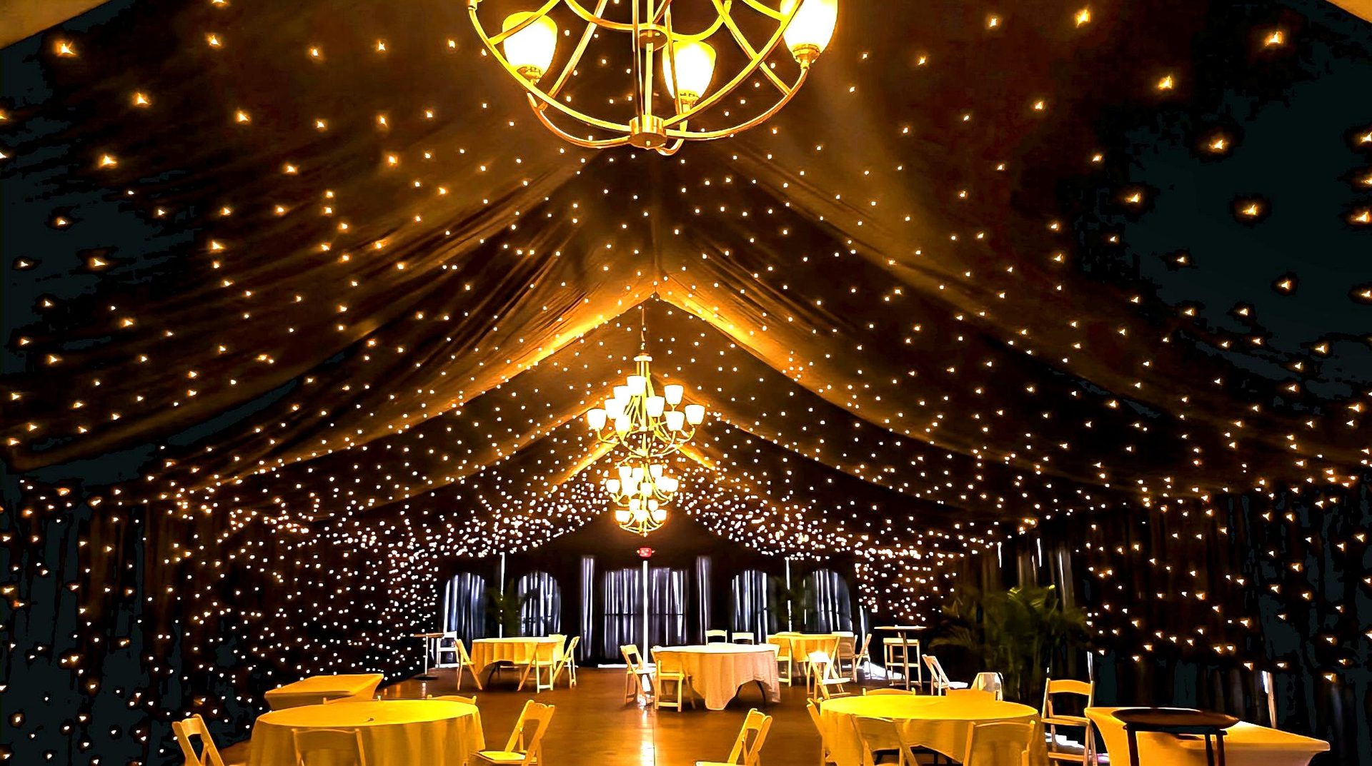 Starry Night ceiling — a tent filled with thousands of warm twinkle lights and chandeliers, by Altitude Event Design and Decor, Tampa Bay